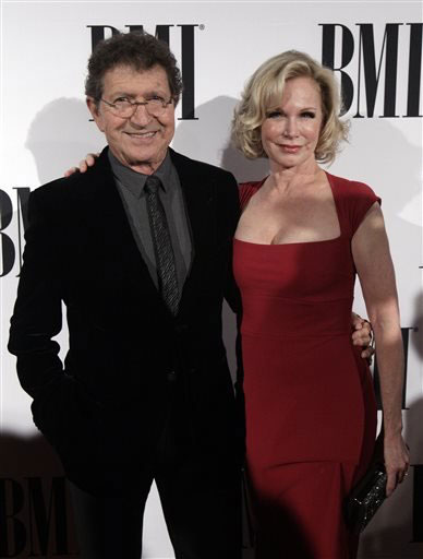 Mac Davis and his wife Lise Kristen Gerard is seen at the 63rd Annual BMI Country Awards at BMI's Music Row offices on Tuesday, Nov. 3, 2015, in Nashville, Tenn. (Photo by Wade Payne/Invision/AP)